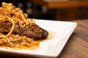 Argentine Chorizo steak, with risotto and caramelized fried onion