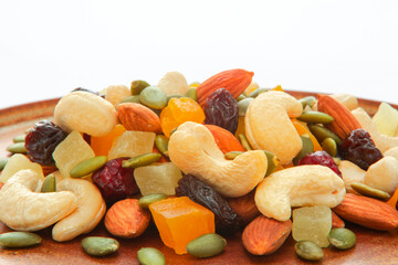 The plate contains nutritious mixed nuts