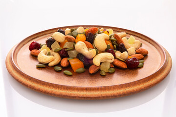 The plate contains nutritious mixed nuts