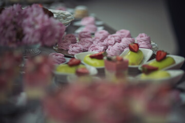Tasty desserts, cakes and pastry on the wedding sweet buffet