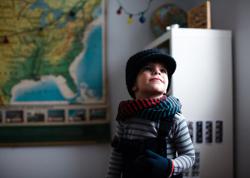 boy in winter gear indoors