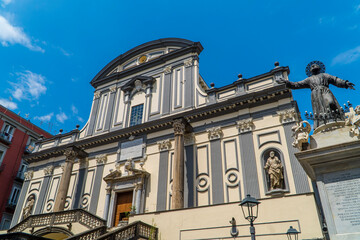 Fototapeta na wymiar View of Basilica di San Paolo Maggiore in the historic center of Naples, Italy with angel statue