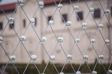Closeup of flowers on a beautiful wedding arch. Preparation for a wedding event. Wedding ceremony arch with lots of white flowers. Selective focus.
