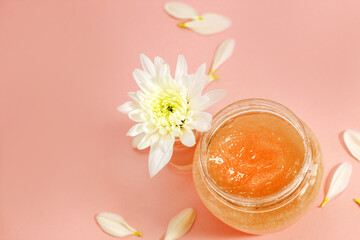 Chrysanthemum and petals with a natural body and face scrub. Space for text.