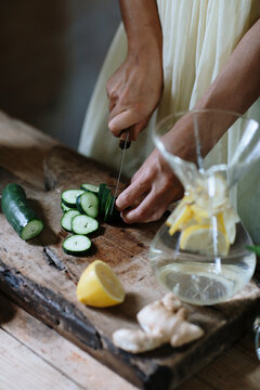 Female making natural vitamin drink