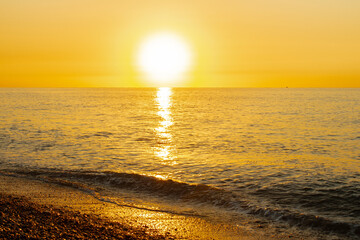 
Sun rising over a beach