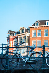 Fototapeta na wymiar Bike in front of canal houses