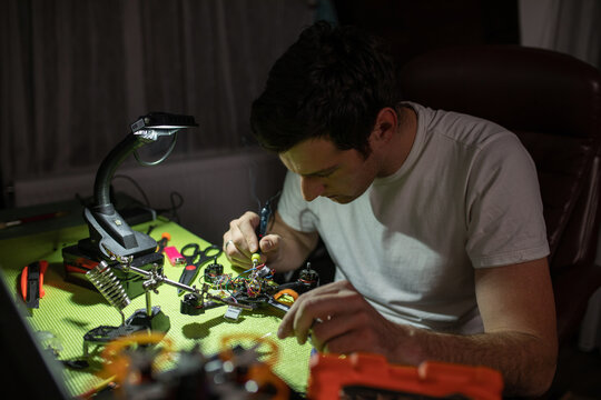 Man repair a drone