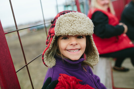 portrait of smiling child in winter hat