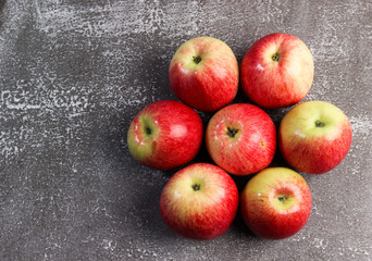 Ripe red green apples on a dark background. Top view, flat lay