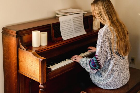 young woman playing piano