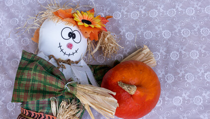 Scarecrow, pumpkin to celebrate halloween and thanksgiving. Havest and fall concept.