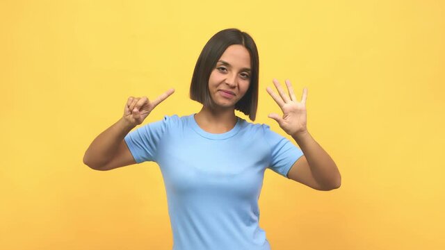 Young indian woman showing number six, symbol of counting, concept of mathematics, confident and cheerful