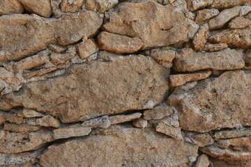 texture di muro di sassi marroni