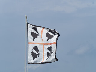 the Sardinia  flag   (Four Moors) flutters in the wind