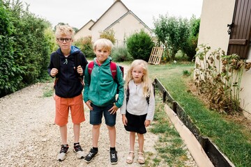 three kids ready for school