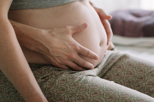 Professional Osteopath Working With Pregnant Caucasian Woman