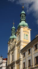 Fototapeta na wymiar Church of Assumption of Virgin Mary at Large square (Velke namesti) in Hradec Kralove. Czech Republic