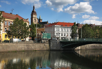 Fototapeta na wymiar White tower and bridge over Elbe river in Hradec Kralove. Czech Republic