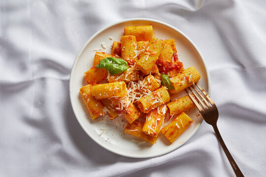 Pasta served with tomato sauce and parmesan.