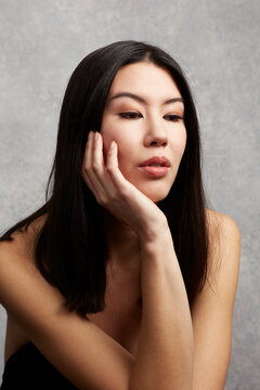 Mixed Race Asian Woman Posing Thoughtfully