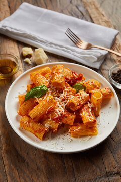 Pasta served with tomato sauce and parmesan.