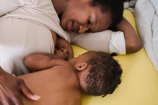 mother nursing her toddler