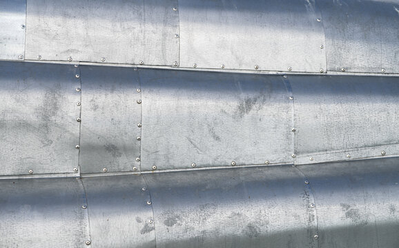 Scratched, Old Surface Of Metal Rivetted Sheets. Plane Hull Alike Pattern / Texture.