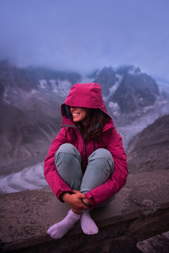 Young woman standing in the rain