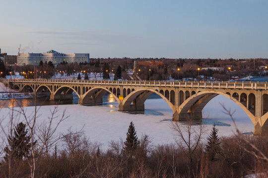 City view along river at sunset