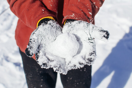 Man holding a snowball