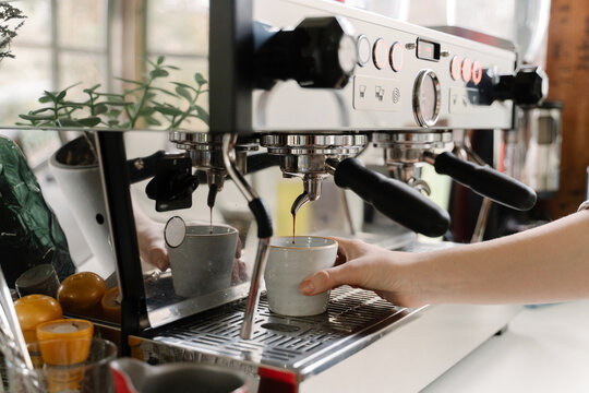 Young woman working at coffee bar