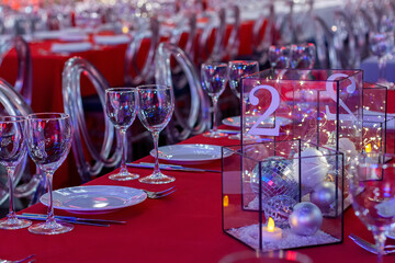 The table in the restaurant is decorated with Christmas decorations. Table number two