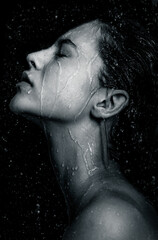 Portrait young model  in water. Spa, skincare and wellness.  Shower, water, moisturizing concept.