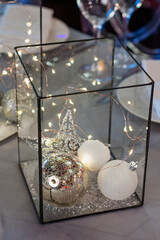 The table in the restaurant is decorated with Christmas decorations