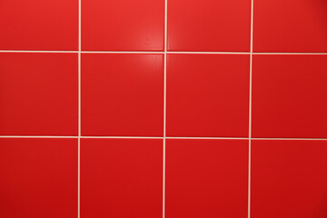 background of red ceramic tiles on the wall