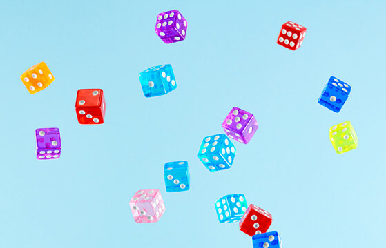 Dice in Air Against Blue Background