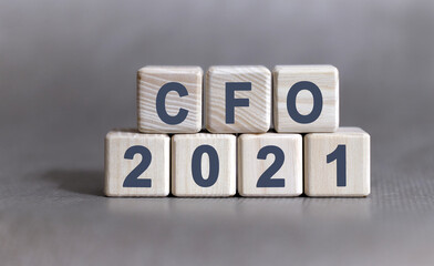 CFO text on wooden cubes on a monochrome background