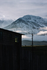 Beautiful mountain behind a house with sunlight