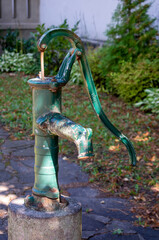 Old Vintage hand operated water pump in the garden.