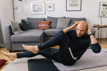 Young man doing home workout