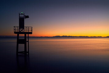 Garry Point Sunset Richmond BC. Georgia Strait and Salish Sea at twilight looking towards Vancouver Island.

