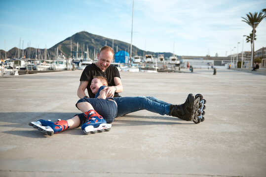 Father and son with roller skates