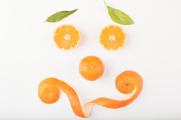 Smiling face made from half of ripe orange fruit, happy diet concept