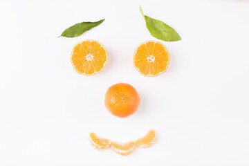 Fototapeta na wymiar Smiling face made from half of ripe orange fruit, happy diet concept