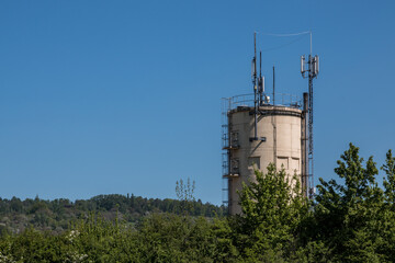 Antennas on a small tower in the center of the town