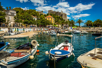 The harbour at Herceg Novi, Montenegro with the fortress in the background - obrazy, fototapety, plakaty