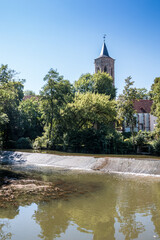 Fototapeta na wymiar The church by the river in the park