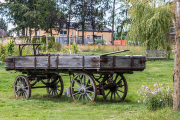 Fototapeta na wymiar Old wooden wagon for horses or cattle to transport things