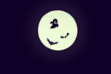 Halloween background.Round full moon, silhouettes of ghosts and bats on a uniform dark background. copy space.creepy mood